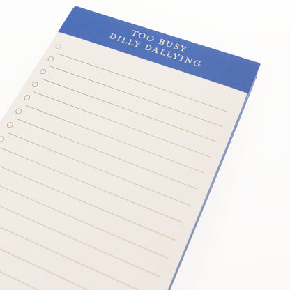 Blue Scallop List Pad, A cream list pad with a cornflower blue header reading Too Busy Dilly Dallying and a scalloped bottom edge.