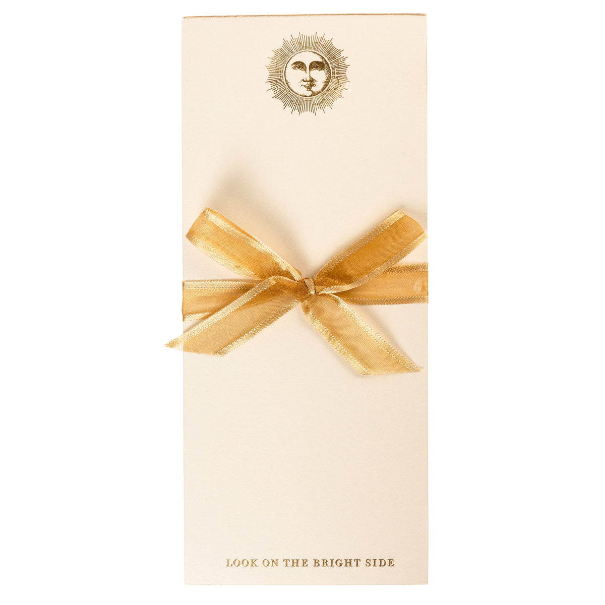 La Petite Presse Sun Gilded Desktop Notepad, A cream notepad with a gold foil sun and face design at the top and the words Look on the Bright Side stamped in gold at the bottom.