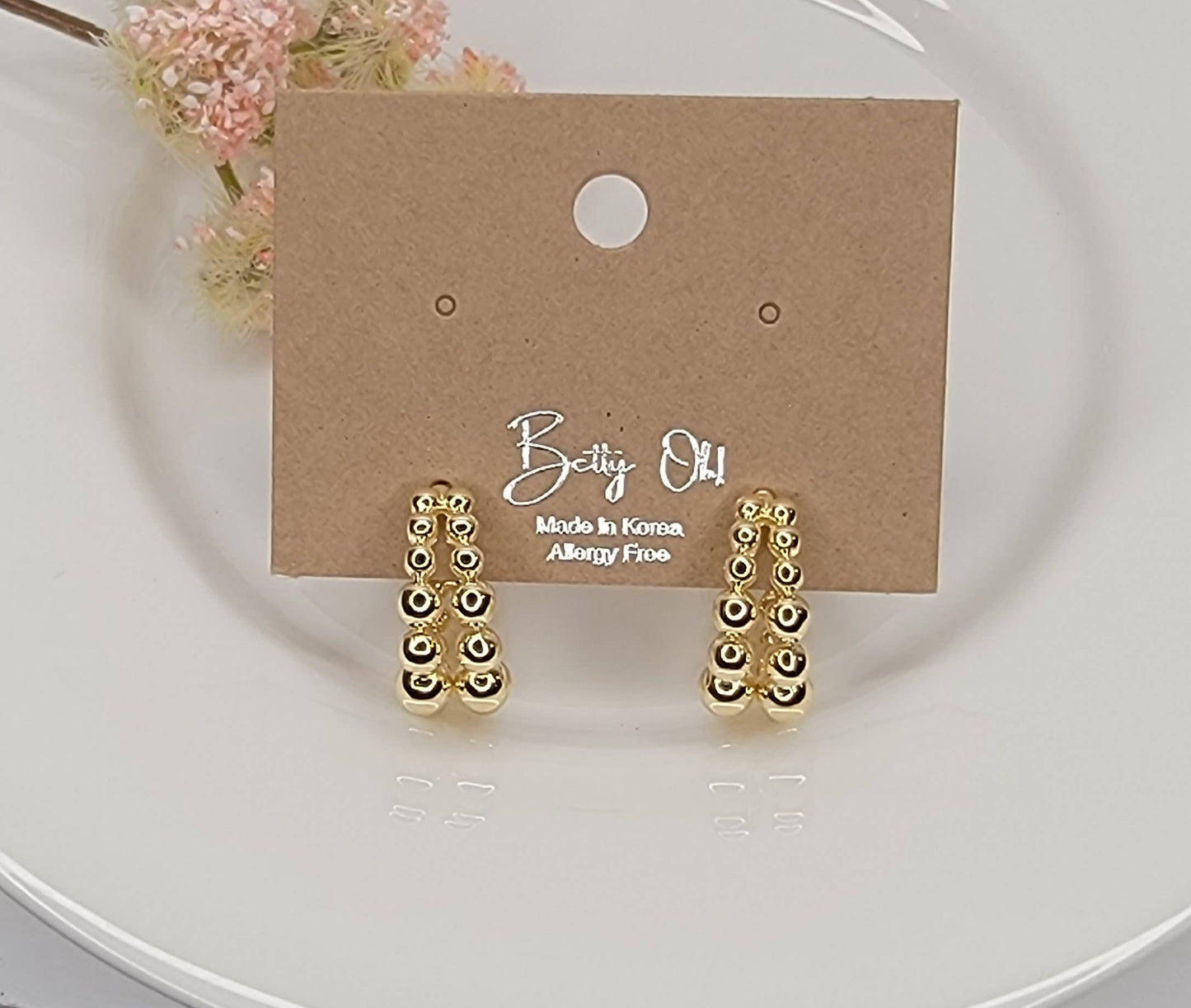 BEADED HOOP EARRINGS.