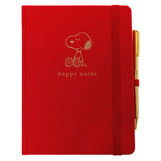 Peanuts Fabric-Bound Journal with Pen, A red fabric journal with a gold foil Snoopy illustration and the words happy notes, paired with a gold pen tucked into a loop along the spine.
