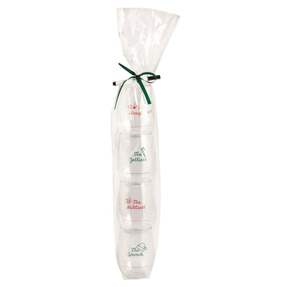 Christmas Stemless Wine Cup Set with Marker, Four clear stemless wine cups stacked inside a cello sleeve tied with a green ribbon, each printed with a red or green holiday title and a dotted name line, with a black marker alongside.