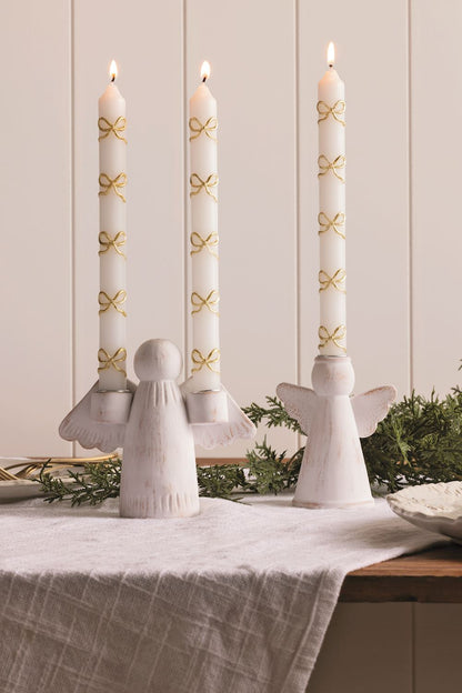 Terracotta Angel Double Taper Candle Holder, A whitewashed terracotta angel figure with spread wings, each wing holding a metal lined well for a taper candle.