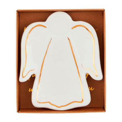 Gold Trimmed Angel Tidbit Dish, A white ceramic dish shaped like an angel with gold lines tracing the wings, head and hem, resting in an open kraft gift box printed with gold script.