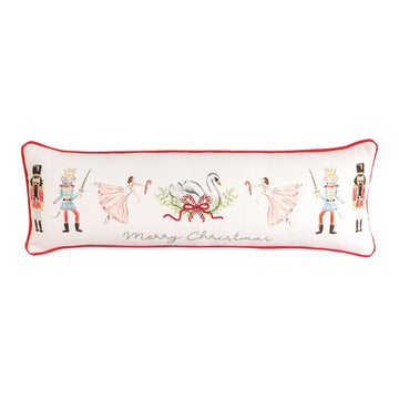 Nutcracker Merry Christmas Long Pillow, Long white pillow with red velvet piping, painted with nutcracker soldiers, crowned mice with swords, pink ballerinas and a swan in a wreath, and Merry Christmas in green script.