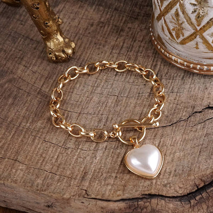 Soft Devotion – Pearlized Puffy Heart Toggle Chain Bracelet in Gold
