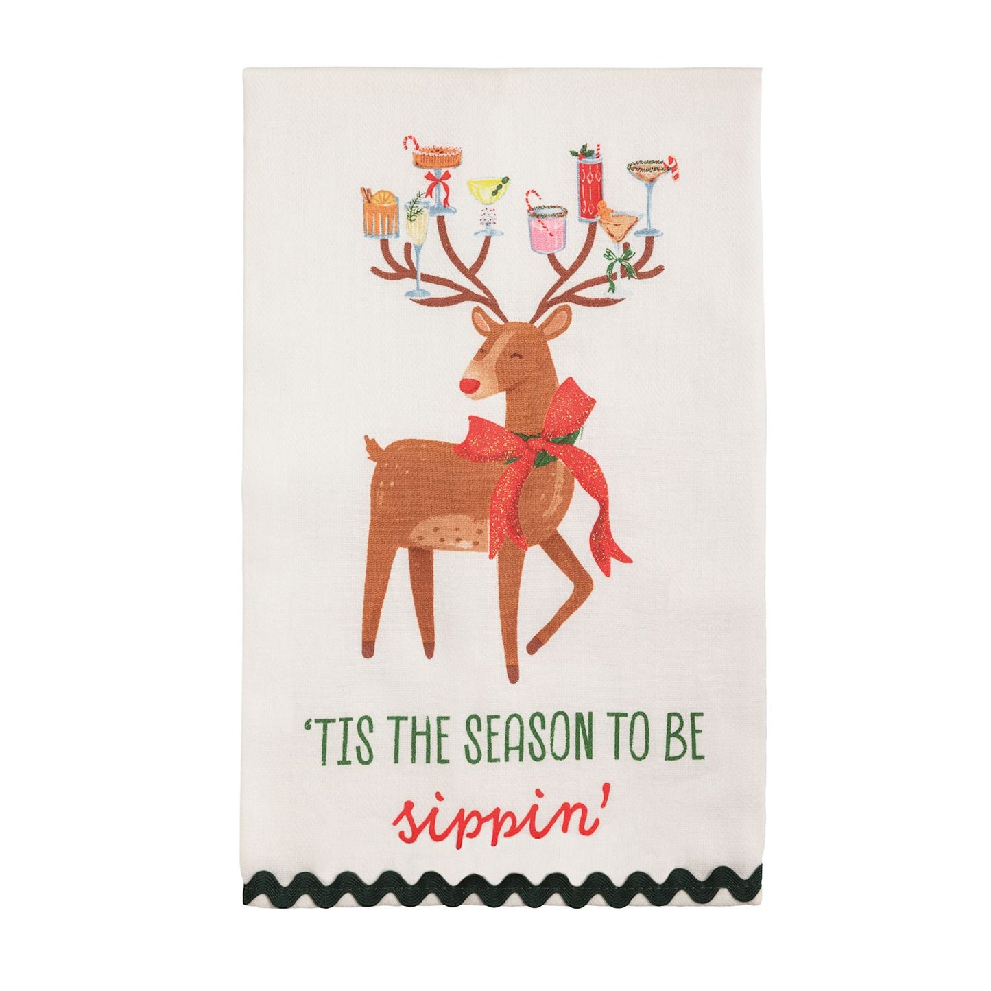 Tis the Season Reindeer Glitter Hand Towel, A cream cotton hand towel printed with a brown reindeer in a glittered red bow carrying holiday cocktails on his antlers, over the words tis the season to be sippin, with a dark green ric-rac hem.