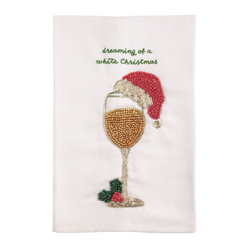 Dreaming of a White Christmas Beaded Wine Glass Towel, A white cotton towel with green embroidered script reading dreaming of a white Christmas above a beaded wine glass wearing a red santa hat, with holly at its base.