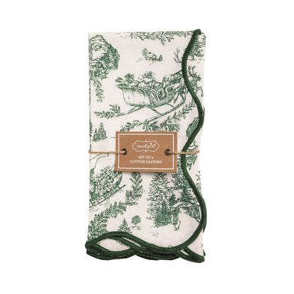Green Toile Christmas Napkin Set of Four, Four cream cotton napkins printed in green Christmas toile with sleighs, reindeer and pine trees, edged with dark green scalloped stitching.
