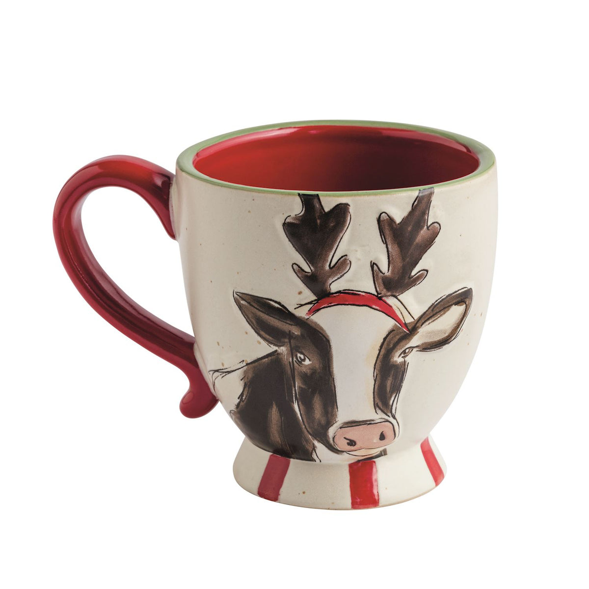 Farmhouse Christmas Cow with Antlers Stoneware Mug, A cream speckled stoneware pedestal mug hand-painted with a cow wearing raised antlers and a red band, with a red interior, red handle and red striped foot.