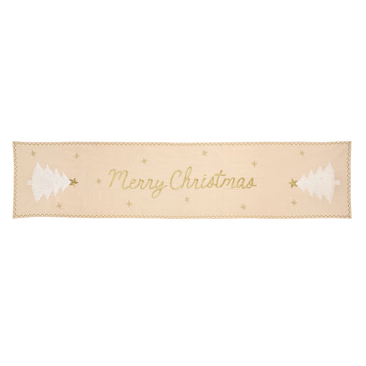 Merry Christmas Snowflake Tree Table Runner, Long pale cream table runner embroidered with Merry Christmas in gold script, a white tree with a gold star at each end, small gold stars scattered between, and a gold zigzag border.