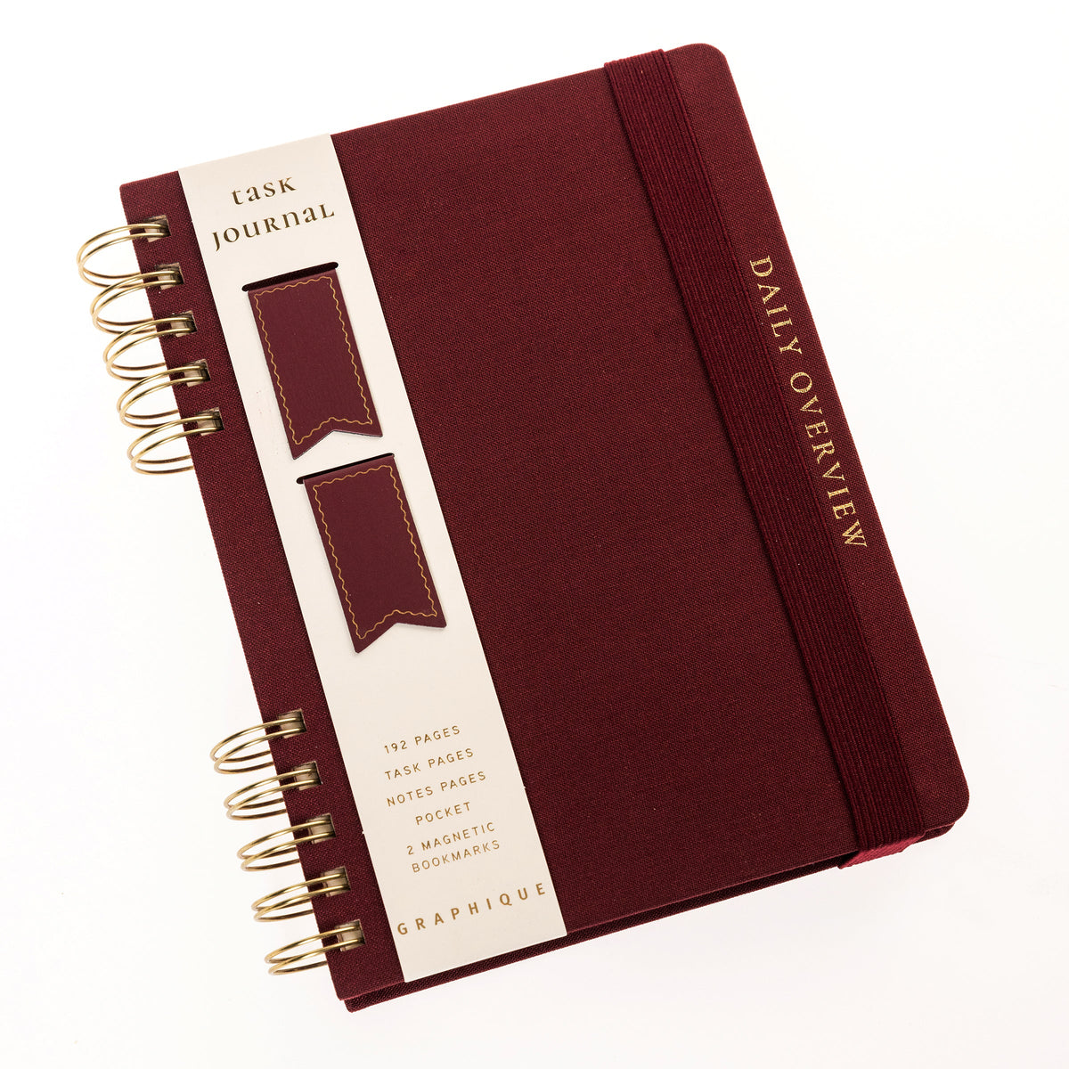 Burgundy Fabric-Bound Task Journal, A burgundy fabric-covered task journal with gold twin wire spirals and two maroon ribbon bookmark tabs, closed with an elastic band.