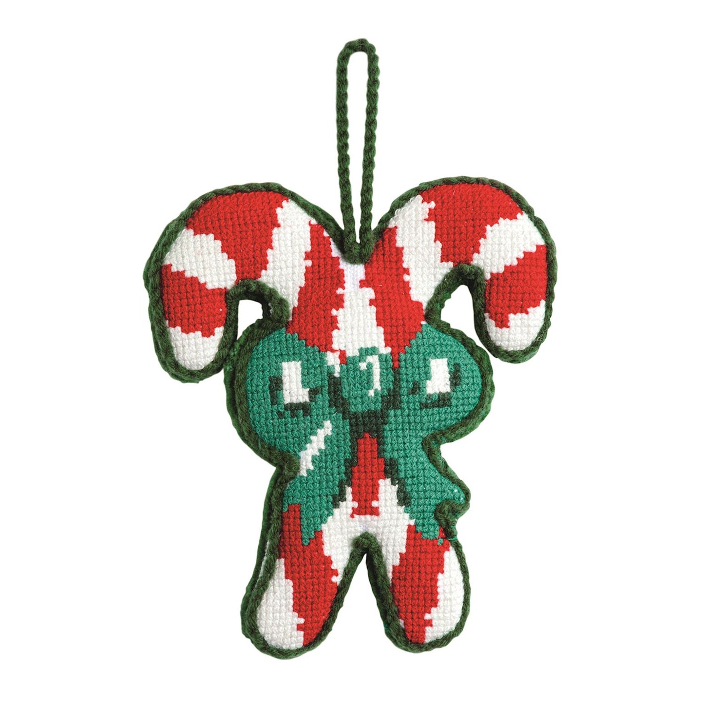 Candy Cane Needlepoint Christmas Ornament, A needlepoint ornament of two crossed red and white candy canes tied with a green stitched bow, edged in green with a green cord hanging loop.