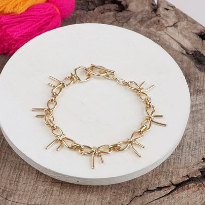 PennyLine inc - Bow Link Bracelet Gold Tone