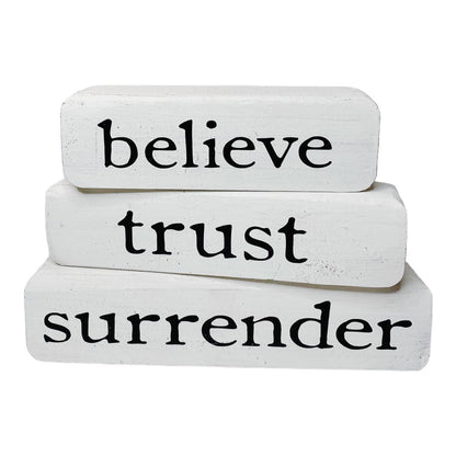Believe Trust Surrender – Brown Stacked Blocks