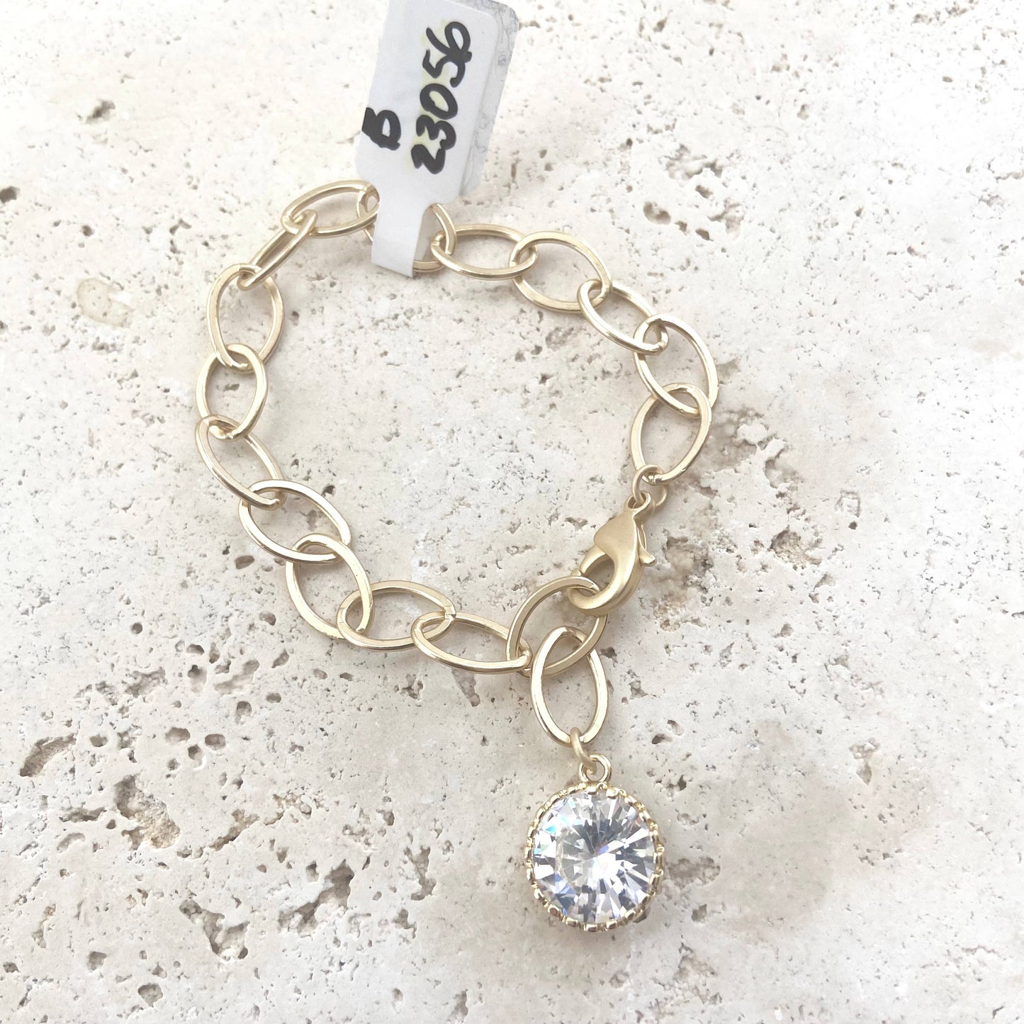 Matte gold bracelet with crystal charm