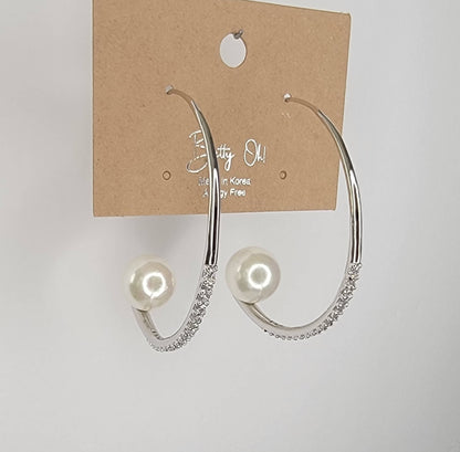 HOOP EARRING EMBEDDED WITH STONE LEADING TO A PEARL PERCHED