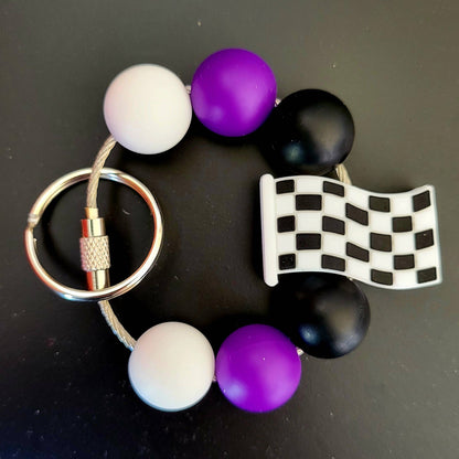 4 giros a la izquierda - Llavero con dije de vaso