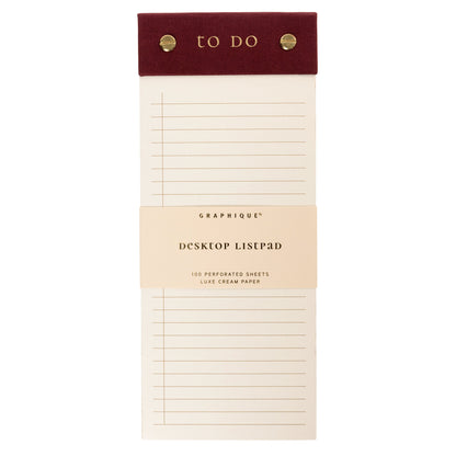 Burgundy Fabric-Bound Desktop Notepad, A burgundy fabric desktop notepad with to Do lettered in gold foil and two gold posts at the top.