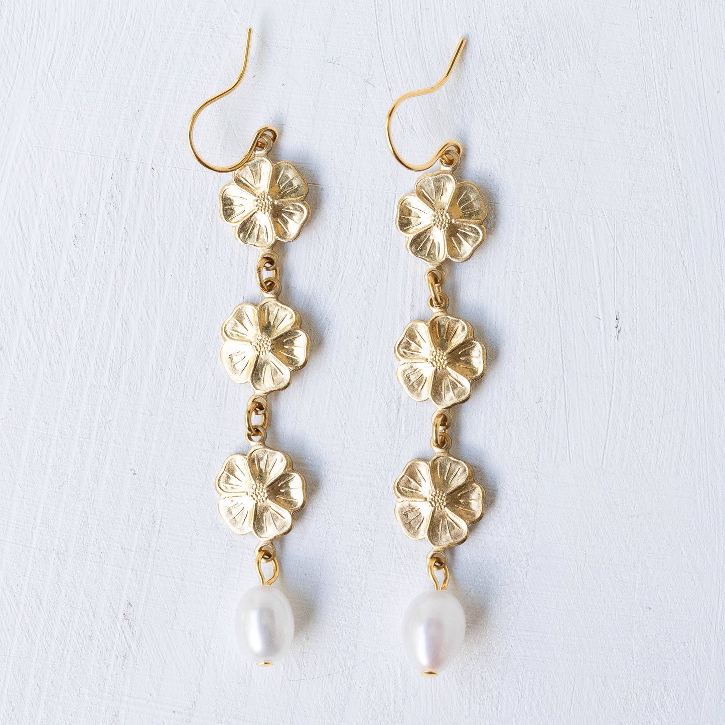 Pearl and three flowers dangle earrings