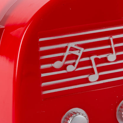 Gerson This retro snow globe features a vintage style red radio