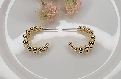 BEADED HOOP EARRINGS.