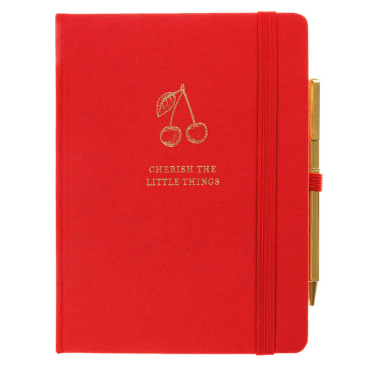La Petite Presse Cherry Fabric-Bound Journal with Pen, A cherry red fabric journal with gold foil cherries and the words Cherish the Little Things on the cover, paired with a gold twist pen.