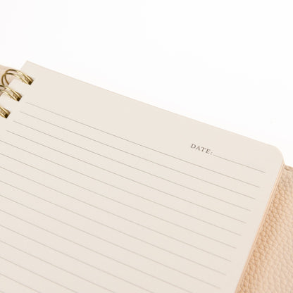 Taupe Vegan Leather Wrap Journal, A taupe vegan leather wrap journal with a scalloped flap and pebbled texture, shown open with its removable spiral insert and pen loop.