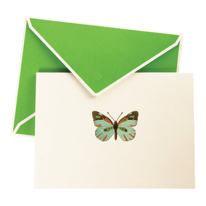 La Petite Presse Butterfly Boxed Correspondence Notes, A cream notecard with a colorful teal, orange, and brown foil butterfly, paired with a bright green lined envelope in an open teal gift box.