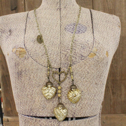 Collar retro de oro viejo "Tres veces el amor"