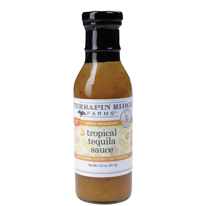 A glass bottle of golden Terrapin Ridge Farms tropical tequila sauce with a black neck and a white label reading with mango, coconut and pineapple, net wt. 14.5 oz.