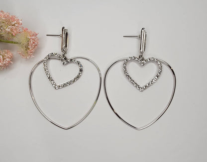 DOUBLE HEART DANGLE EARRINGS.