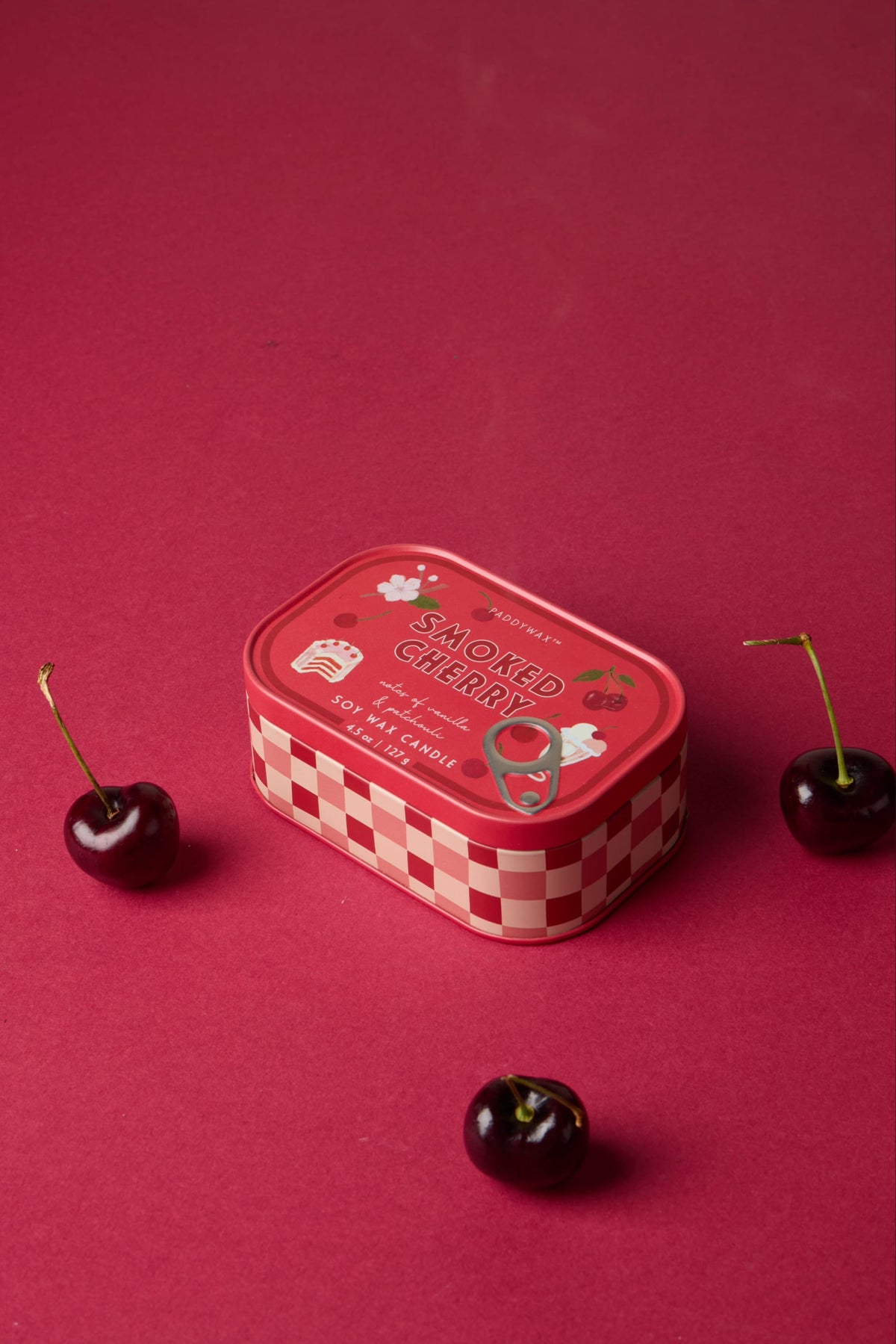 Bistro 4.5 oz Tin Candle, A pink tin candle illustrated with martini glasses, olives and a lemon, labeled Martini Soy Wax Candle.