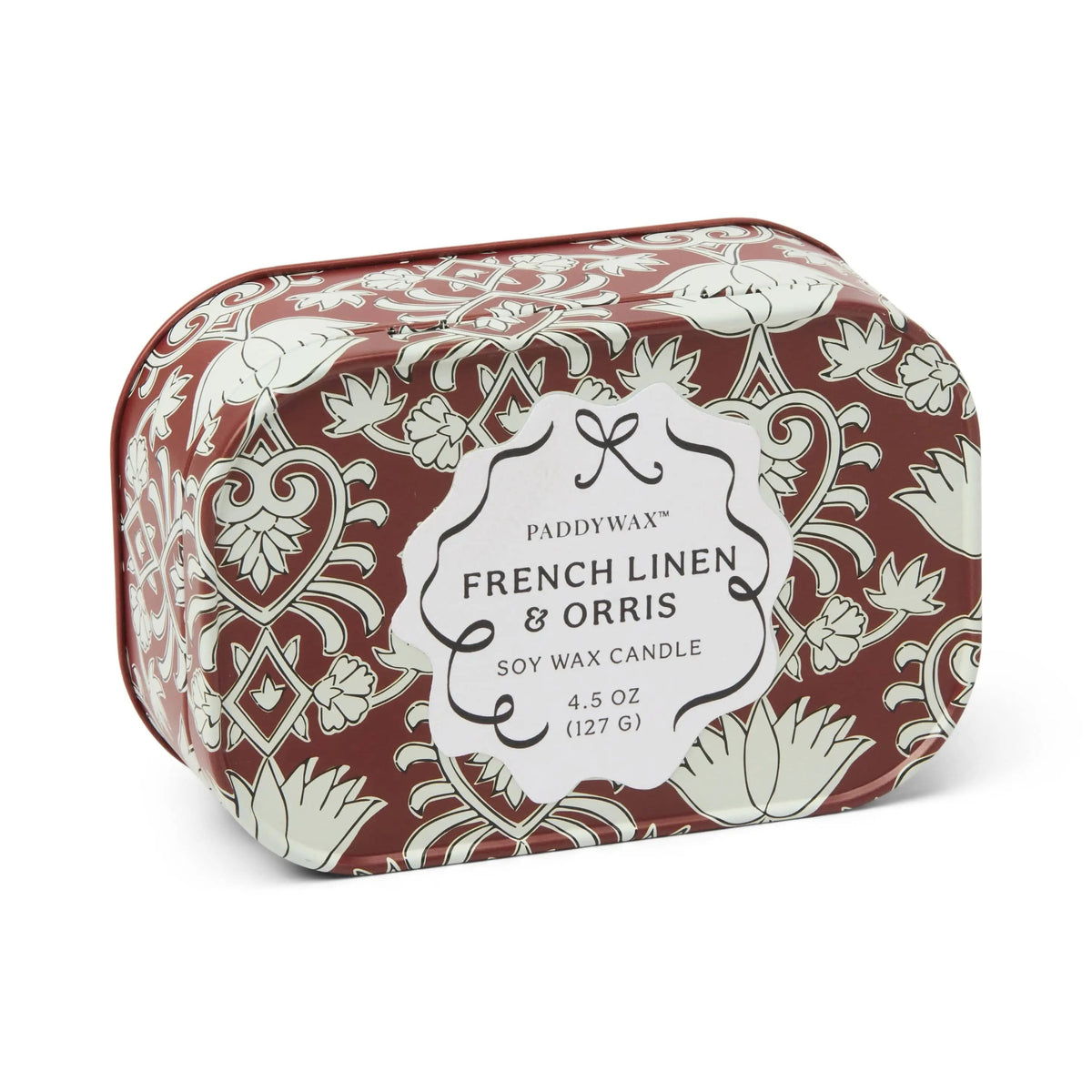 Chérie 4.5 oz Tin Candle, A black metal tin printed with a cream floral pattern, labeled Black Fig and Olive Soy Wax Candle.