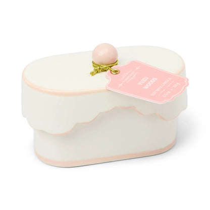 Chérie 5.5 oz Ceramic Candle, A white ceramic lidded candle box with a black scalloped rim and a round knob, tagged Black Fig and Olive.
