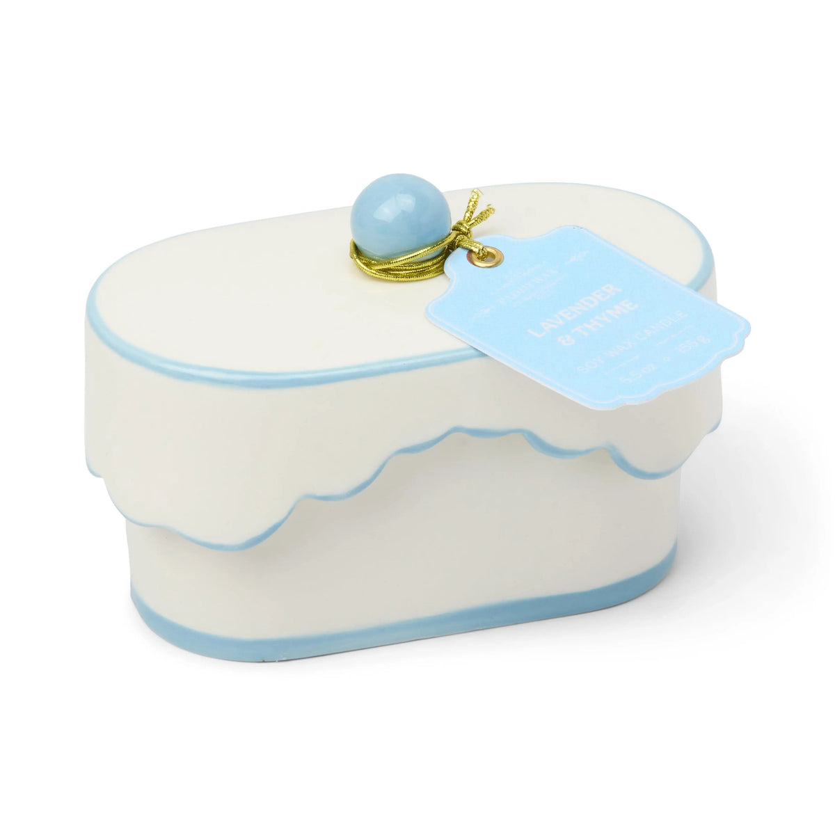 Chérie 5.5 oz Ceramic Candle, A white ceramic lidded candle box with a black scalloped rim and a round knob, tagged Black Fig and Olive.