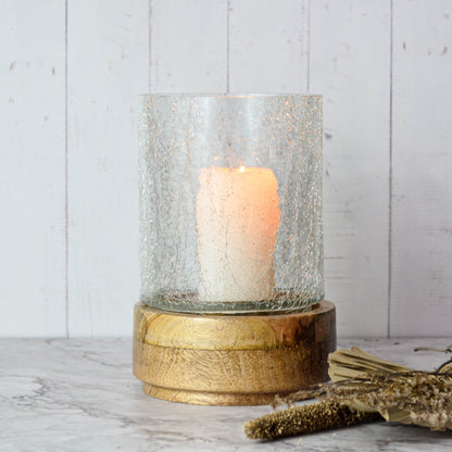 Radiance Crackle Glass Candle Holder, A clear glass candle holder with a crackled texture, on a round natural wood base, shown empty against a white background.