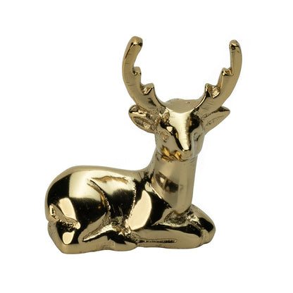 Blitzen Reindeer Placecard Holder, Gold, A small brass reindeer figure in a gold finish, lying down with its antlers raised.