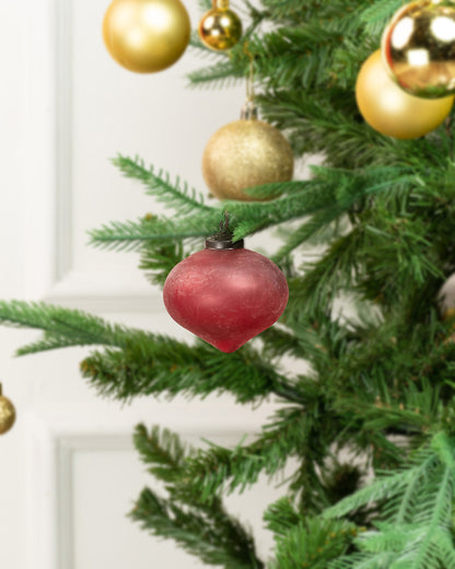 Indus Glass Belly Ornament, Red, A glossy red glass ornament in a rounded belly shape that tapers to a point, with a dark metal cap and hanging ring, shown against a plain white background.