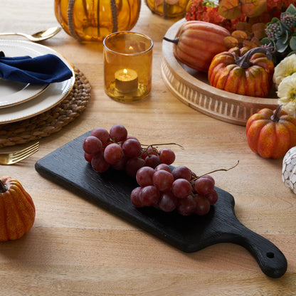Luna Black Wood Cutting Board, A black finish wood cutting board with a rectangular blade and a paddle handle, shown from above against a white background.