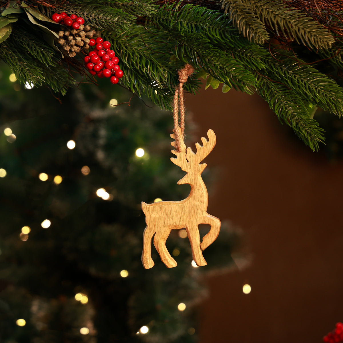 Norma Wooden Reindeer Ornament, A flat natural wood reindeer cutout ornament with a jute hanging loop, shown against a plain white background.