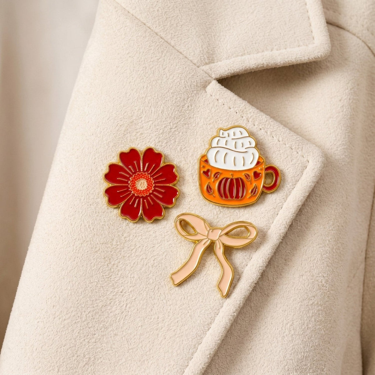 Enamel Pin Pack, A boxed set of three gold enamel pins in the Latte Love design, a coffee cup, a teddy bear, and a pink bow.