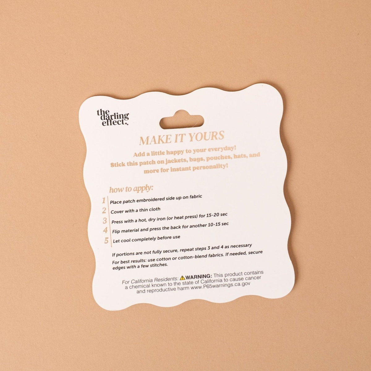 Mix & Match Iron-On Patch, A pink Be Kind patch on its patch card, with BE KIND spelled out in bold pink lettering.