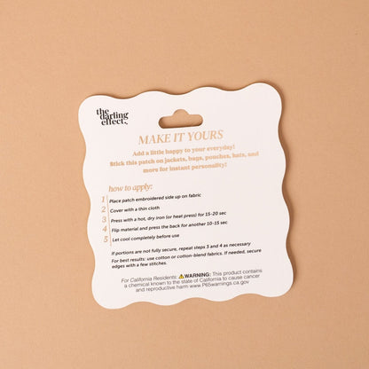 Mix & Match Iron-On Patch, A pink Be Kind patch on its patch card, with BE KIND spelled out in bold pink lettering.