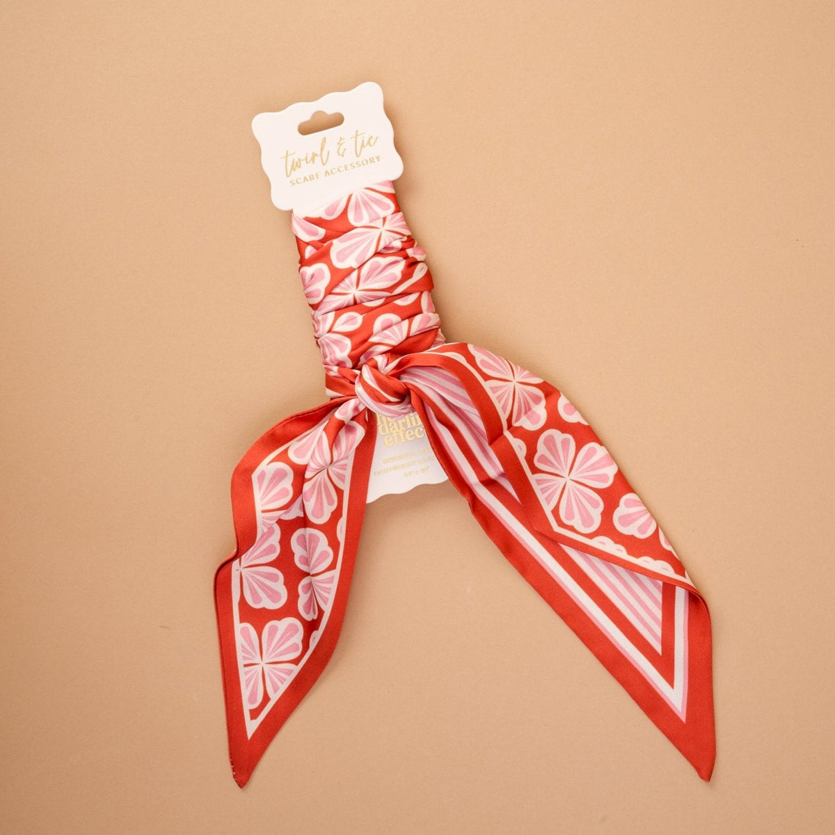 Twirl & Tie Scarf Accessory, A red and white gingham satin scarf tied in a knot, showing a red polka dot pattern on the reverse side of the tails.