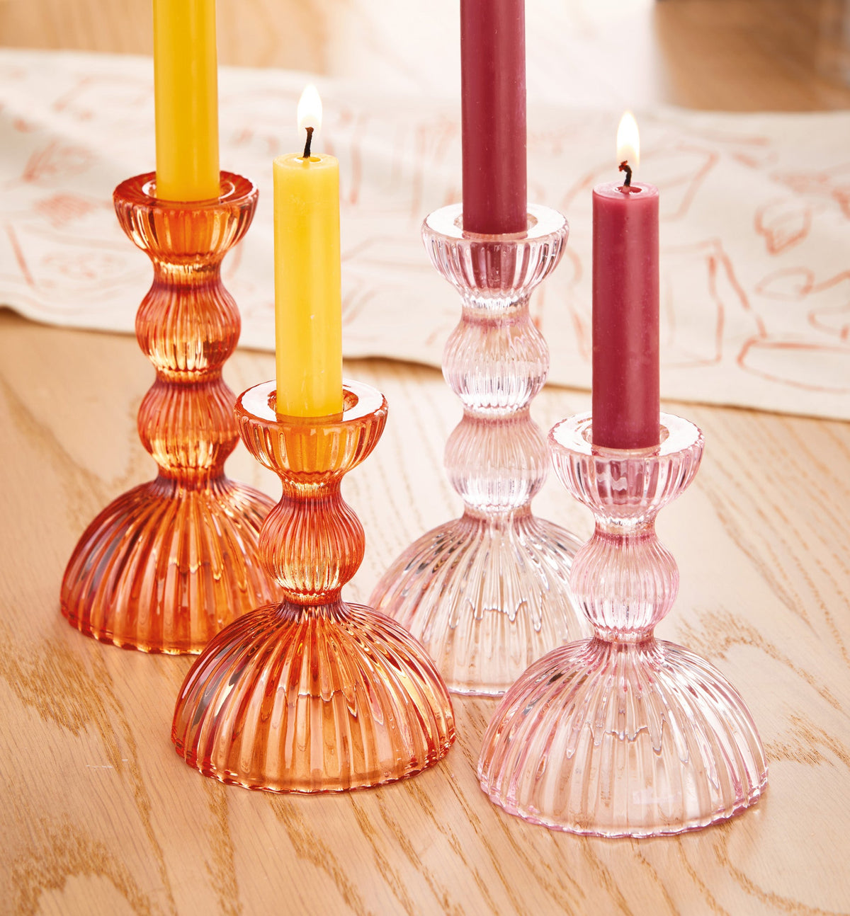 Orange Ella Taper Holder, A single orange ribbed glass taper candle holder with a flared top and wide base, shown empty on a white background.