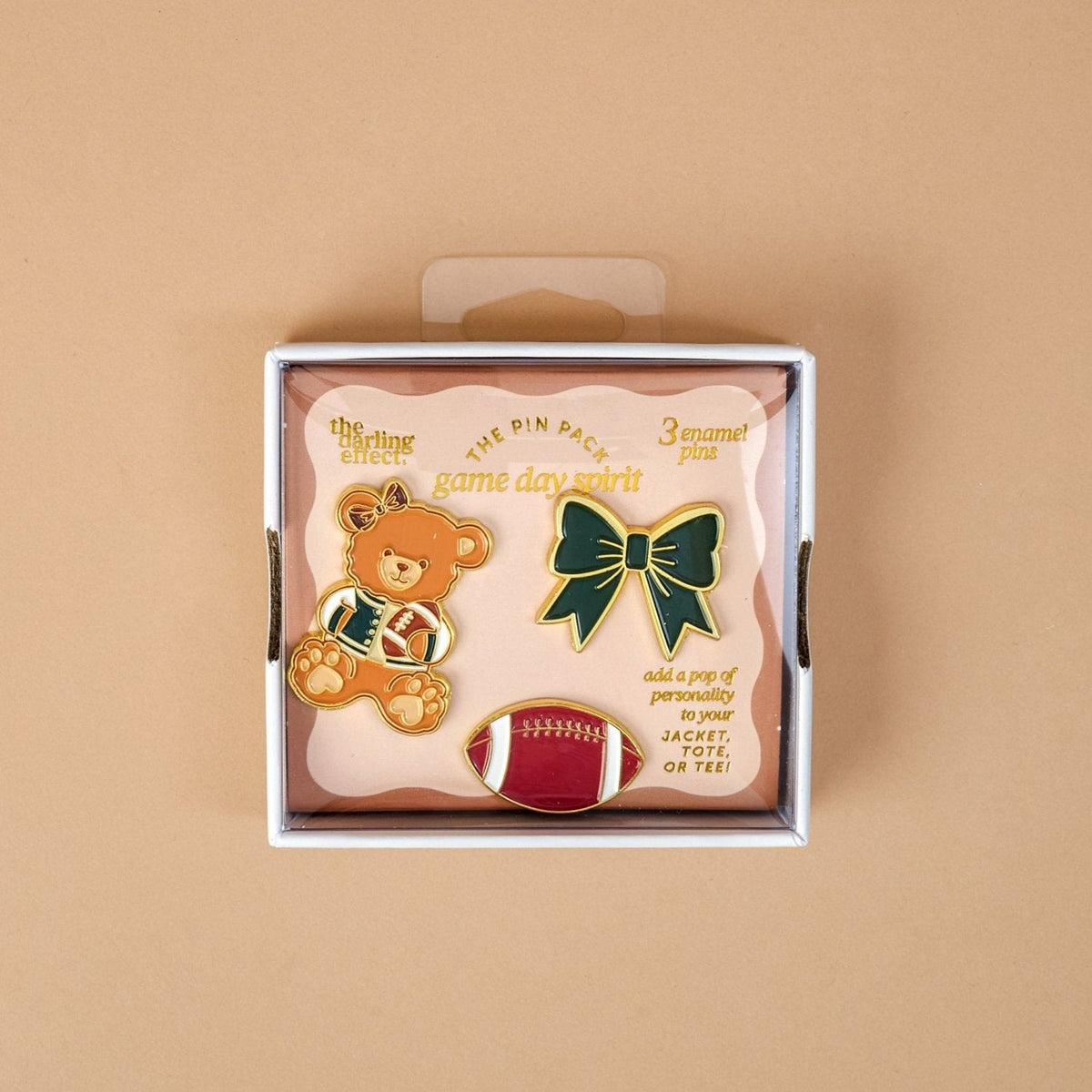 Enamel Pin Pack, A boxed set of three gold enamel pins in the Latte Love design, a coffee cup, a teddy bear, and a pink bow.