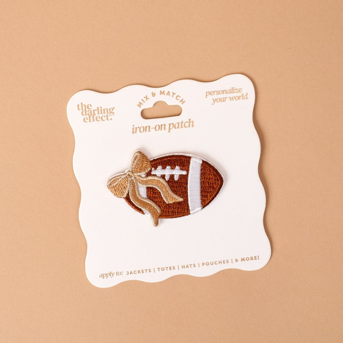 Mix & Match Iron-On Patch, A pink Be Kind patch on its patch card, with BE KIND spelled out in bold pink lettering.