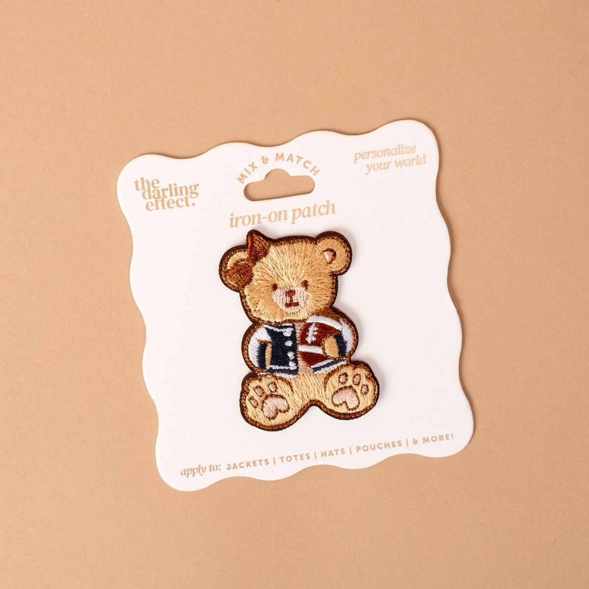 Mix & Match Iron-On Patch, A pink Be Kind patch on its patch card, with BE KIND spelled out in bold pink lettering.