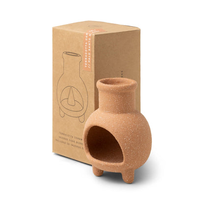 Palo Santo & Sage Chiminea Incense Holder, A terracotta ceramic chiminea shaped incense holder standing next to its kraft packaging box labeled Palo Santo and Sage.