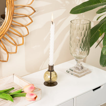 Kefi Olive Glass Round Candle Holder, A round olive glass candle holder with a textured, faceted surface and a dark bronze metal taper cup on top, set on a flat round base, shown alone.